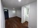 Bright bedroom showcases hardwood floors and an ensuite bathroom at 3815 Nw Avenue R Ave, Winter Haven, FL 33881