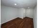 Bedroom featuring a closet and hardwood floors at 3815 Nw Avenue R Ave, Winter Haven, FL 33881