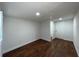 This bedroom features hardwood floors, fresh white paint and recessed lighting at 3815 Nw Avenue R Ave, Winter Haven, FL 33881
