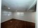 Bedroom featuring two windows and hardwood floors at 3815 Nw Avenue R Ave, Winter Haven, FL 33881