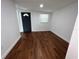 The bedroom features hardwood floors and neutral walls at 3815 Nw Avenue R Ave, Winter Haven, FL 33881
