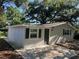 Exterior view of home, featuring a new walkway and fresh paint at 3815 Nw Avenue R Ave, Winter Haven, FL 33881