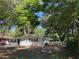 Bright, single-story house featuring white exterior, dark shutters, and a spacious yard at 3815 Nw Avenue R Ave, Winter Haven, FL 33881
