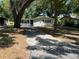 Charming single-story home with a well-maintained front yard and a long driveway at 3815 Nw Avenue R Ave, Winter Haven, FL 33881