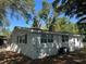 The exterior of the home is freshly painted, with new windows at 3815 Nw Avenue R Ave, Winter Haven, FL 33881