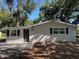 Charming single story home featuring a freshly painted exterior, dark shutters, and a well-manicured front yard at 3815 Nw Avenue R Ave, Winter Haven, FL 33881
