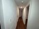 Hallway with hardwood floors and neutral paint at 3815 Nw Avenue R Ave, Winter Haven, FL 33881