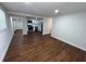 Open floor plan showcases a spacious living area flowing into the modern kitchen with sleek appliances at 3815 Nw Avenue R Ave, Winter Haven, FL 33881