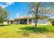 Spacious backyard with a screened-in patio with a picturesque view at 3894 Wind Dancer Cir, St Cloud, FL 34772