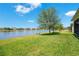 Bask in the beauty of this backyard, offering scenic lake views and a peaceful ambiance for outdoor enjoyment at 3894 Wind Dancer Cir, St Cloud, FL 34772