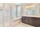 Modern bathroom featuring a walk-in shower, soaking tub, and double vanity sinks at 3894 Wind Dancer Cir, St Cloud, FL 34772