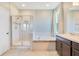 A spacious bathroom with tiled floors, a walk-in shower, soaking tub, and ample vanity space at 3894 Wind Dancer Cir, St Cloud, FL 34772