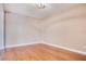 Hardwood floors and neutral walls complement this bonus room at 3894 Wind Dancer Cir, St Cloud, FL 34772