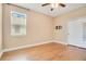 Hardwood floors and neutral walls complement this bonus room at 3894 Wind Dancer Cir, St Cloud, FL 34772