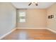 Neutral walls and hardwood floors complement this bonus room at 3894 Wind Dancer Cir, St Cloud, FL 34772
