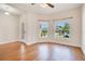 Inviting living room with hardwood floors, natural light, and a view of the outdoors at 3894 Wind Dancer Cir, St Cloud, FL 34772