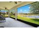 Relaxing screened patio with serene pond and backyard views at 3894 Wind Dancer Cir, St Cloud, FL 34772