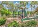 Fun-filled playground with slides, climbing structures, and benches, perfect for outdoor recreation and Gathering enjoyment at 3894 Wind Dancer Cir, St Cloud, FL 34772