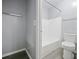 The bathroom offers a tub and shower combination with a white tile surround and updated fixtures for a modern touch at 4215 S Semoran Blvd # 15, Orlando, FL 32822