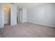 Spacious bedroom with neutral carpet, light walls, and a closet providing ample storage space at 4215 S Semoran Blvd # 15, Orlando, FL 32822