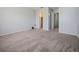 The bedroom features neutral carpet, light walls, and multiple closets offering ample storage space at 4215 S Semoran Blvd # 15, Orlando, FL 32822