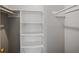 Walk-in closet with built-in shelving offering ample storage for clothes and accessories at 4215 S Semoran Blvd # 15, Orlando, FL 32822