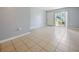 Bright living space with access to an outdoor patio area, enhancing the indoor-outdoor living experience with tile floor at 4215 S Semoran Blvd # 15, Orlando, FL 32822