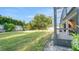 Expansive backyard featuring a well-maintained lawn, mature trees, and a screened-in patio for outdoor enjoyment at 506 Alleria Ct, Auburndale, FL 33823