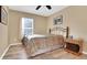 Bedroom featuring wood floor, natural light, and neutral color palette at 506 Alleria Ct, Auburndale, FL 33823