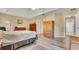 Bedroom with wood-look floors, neutral walls, and plenty of natural light at 506 Alleria Ct, Auburndale, FL 33823