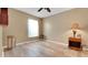 Bedroom with wood-look floors, natural light, and neutral colors at 506 Alleria Ct, Auburndale, FL 33823