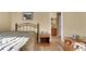 Comfortable bedroom with wood floor, natural light, and a neutral color palette at 506 Alleria Ct, Auburndale, FL 33823