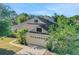 Charming home with a well-manicured lawn, mature trees, and an attached two-car garage at 506 Alleria Ct, Auburndale, FL 33823