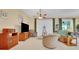 Bright living room features a sliding glass door, tile flooring, and neutral decor at 506 Alleria Ct, Auburndale, FL 33823