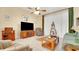 Comfortable living room with tile floors, fan, and media center at 506 Alleria Ct, Auburndale, FL 33823