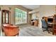 Bright office with hardwood floors, traditional furniture, and a large window at 506 Alleria Ct, Auburndale, FL 33823