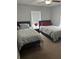 Bright bedroom with two twin beds and large window at 5719 Sweetheart Ct, St Cloud, FL 34772