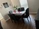 Cozy dining room with table for six and wood-look floors at 5719 Sweetheart Ct, St Cloud, FL 34772