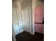 Hallway with closet and pink cabinets at 5719 Sweetheart Ct, St Cloud, FL 34772