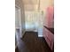 Hallway with pink cabinets and wood floors at 5719 Sweetheart Ct, St Cloud, FL 34772
