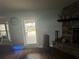 Bright living room with stone fireplace and access to the brick-paved patio at 5719 Sweetheart Ct, St Cloud, FL 34772