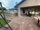 Covered patio featuring a brick bar area, stone pillars, and outdoor dining set at 5719 Sweetheart Ct, St Cloud, FL 34772
