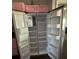 Open refrigerator with pink cabinets in the background at 5719 Sweetheart Ct, St Cloud, FL 34772