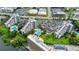Beautiful aerial view of a real estate complex featuring 3 pools and lush landscapes at 6165 Carrier Dr # 1603, Orlando, FL 32819