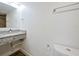 Well lit bathroom featuring granite sink, modern fixtures and a neutral color palette at 6165 Carrier Dr # 1603, Orlando, FL 32819