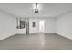 Spacious two-car garage with painted walls, concrete floors, and an access door for convenience at 68 Water Track Loop, Ocala, FL 34472