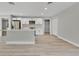 Open-concept living area featuring stainless steel appliances and light gray walls at 68 Water Track Loop, Ocala, FL 34472