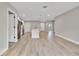 Spacious open floor plan showcasing modern kitchen with island, stainless steel appliances, and durable floors at 68 Water Track Loop, Ocala, FL 34472