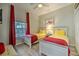 Comfortable bedroom with two beds, red curtains, and beach-themed decor at 702 Gran Bahama Blvd, Davenport, FL 33897