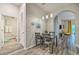 Charming dining space featuring modern lighting and easy access to the living room and bathroom at 702 Gran Bahama Blvd, Davenport, FL 33897
